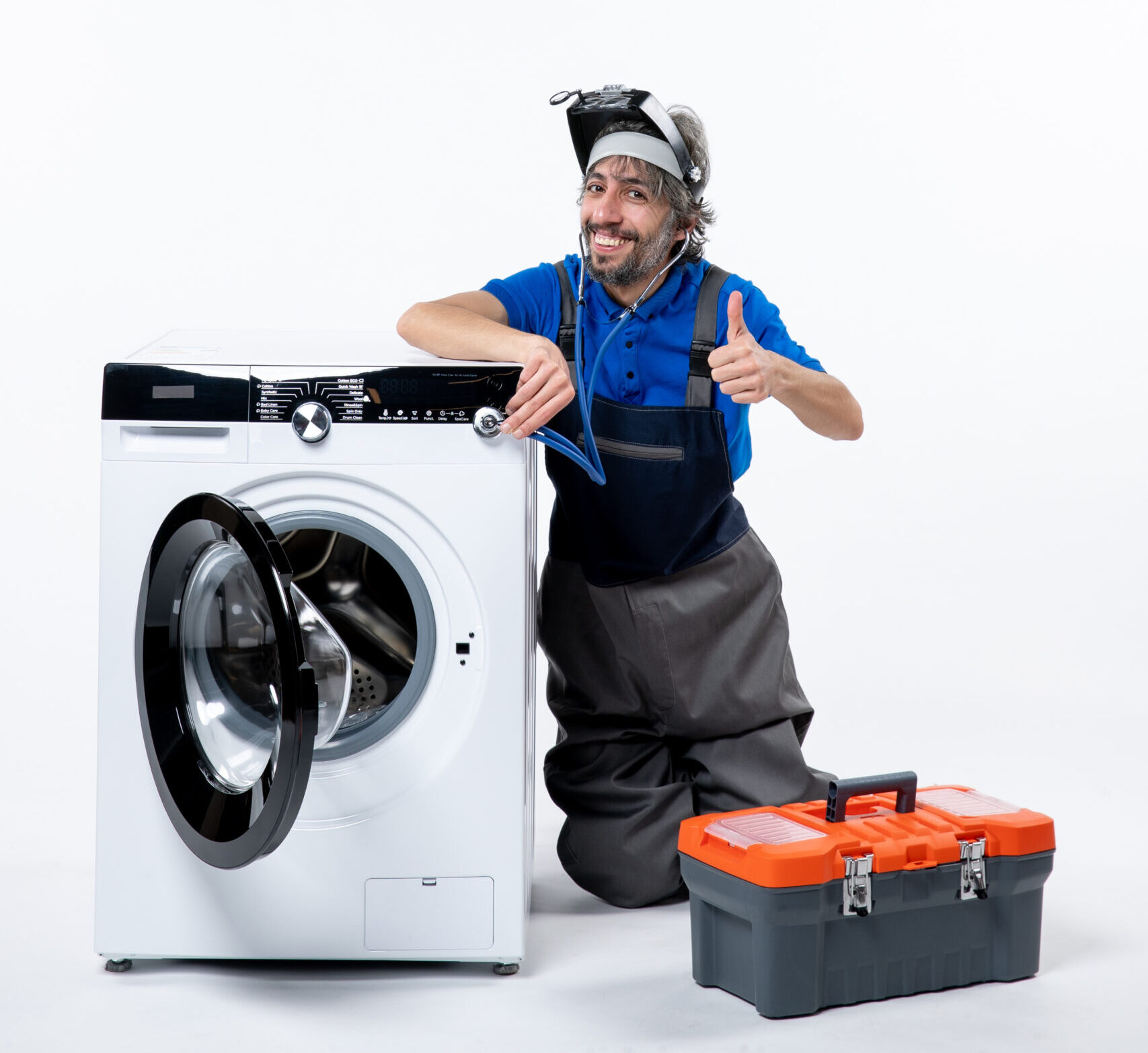 front-view-happy-repairman-sitting-near-washing-machine-making-thumb-up-sign-white-space